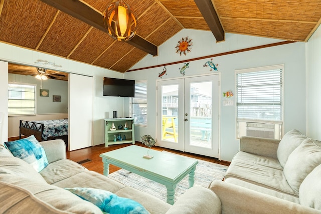 living room with a wealth of natural light, french doors, and ceiling fan