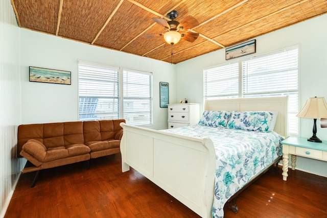 bedroom featuring wooden ceiling, multiple windows, dark wood-type flooring, and ceiling fan