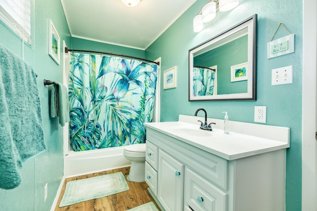 full bathroom featuring toilet, vanity, wood-type flooring, and ornamental molding