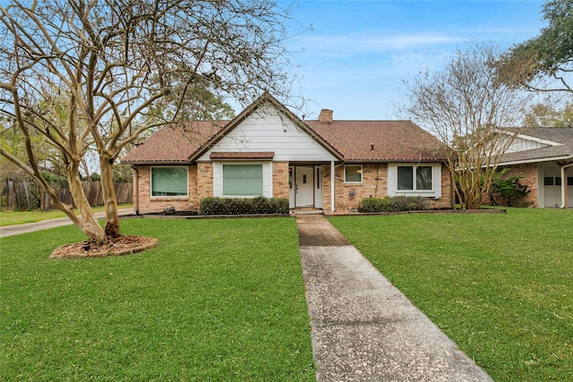 ranch-style home with a front lawn