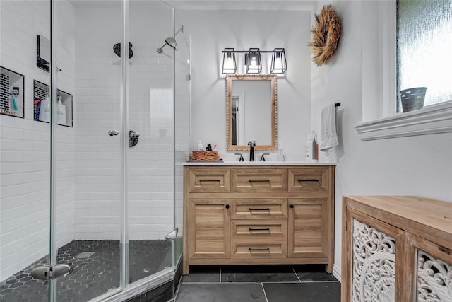 bathroom featuring tile patterned floors, vanity, and an enclosed shower