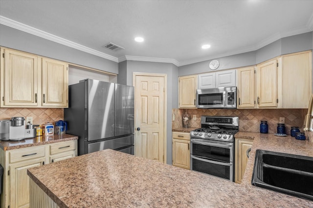 kitchen with crown molding, decorative backsplash, sink, and stainless steel appliances