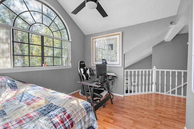 bedroom featuring ceiling fan, light hardwood / wood-style floors, and vaulted ceiling