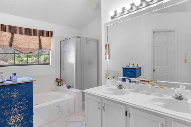 bathroom with tile patterned floors, vanity, lofted ceiling, and shower with separate bathtub