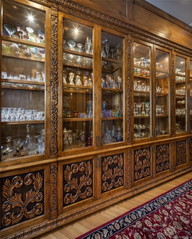 wine area featuring hardwood / wood-style flooring