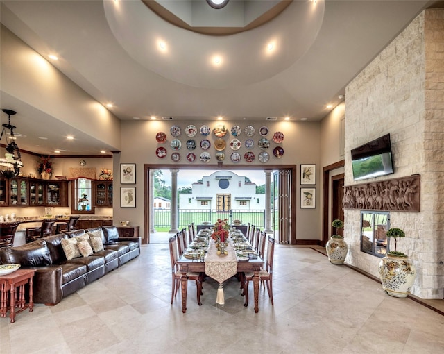 dining space featuring a high ceiling