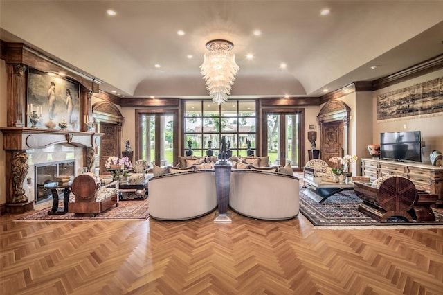 living room with light parquet floors, a wealth of natural light, and vaulted ceiling