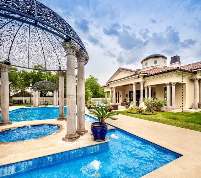 view of swimming pool featuring a gazebo and a patio area