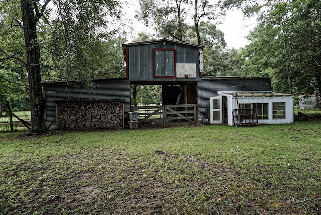 view of outbuilding featuring a yard