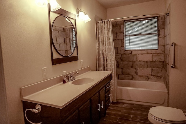 full bathroom with vanity, hardwood / wood-style flooring, toilet, and shower / bathtub combination with curtain