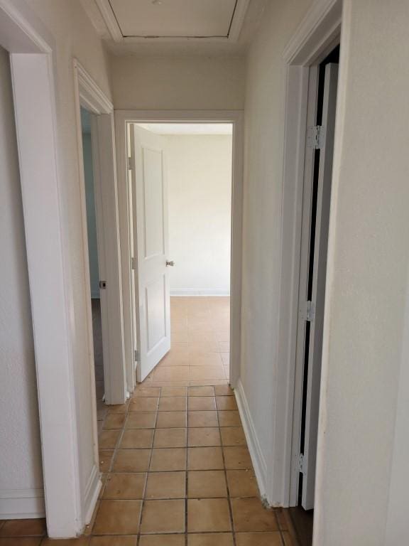 hallway with light tile patterned floors