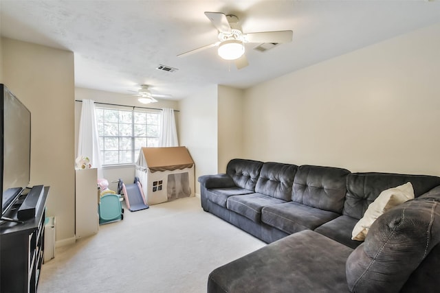 living room with light carpet and ceiling fan