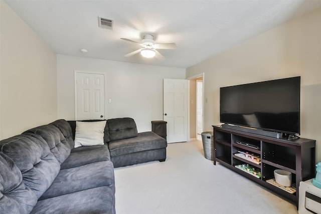 living room with light carpet and ceiling fan