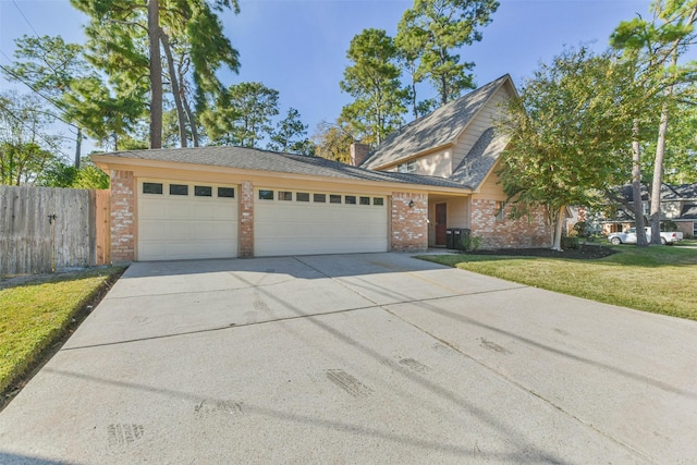 view of front facade featuring a garage and a front yard