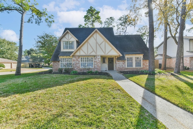 tudor-style house with a front lawn