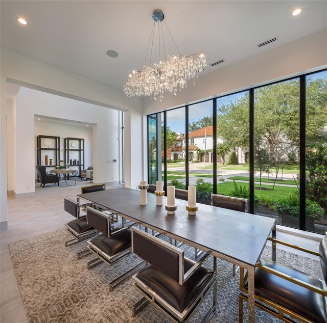 dining area with an inviting chandelier and a healthy amount of sunlight