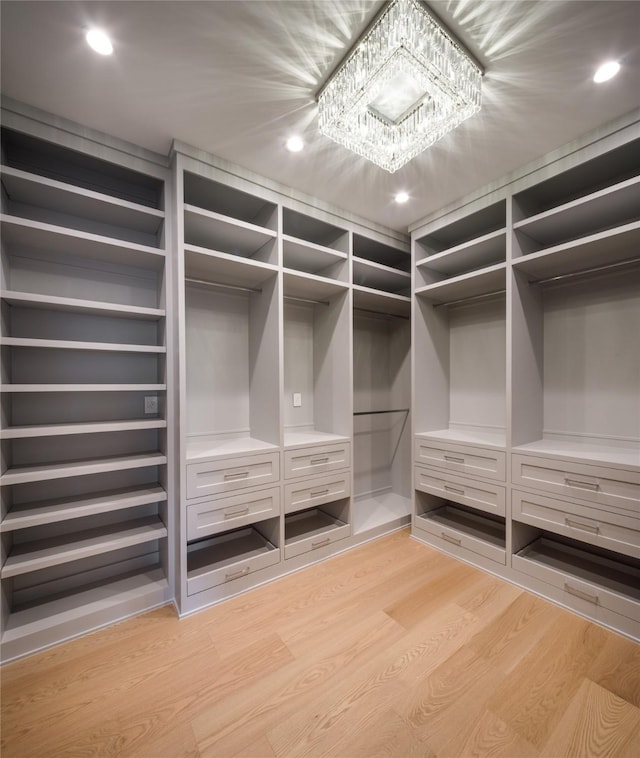 spacious closet featuring light wood-type flooring