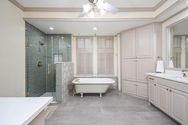 bathroom with vanity, tile patterned flooring, crown molding, and separate shower and tub