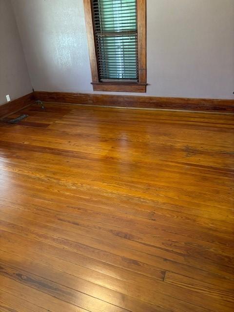 empty room with wood-type flooring