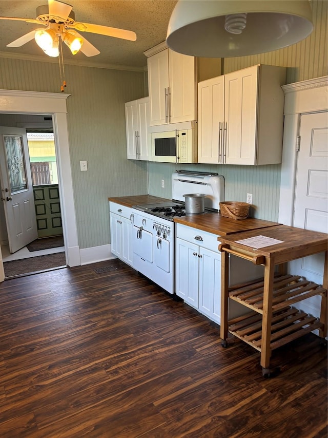 kitchen featuring white cabinets, ceiling fan, white appliances, and dark wood-type flooring