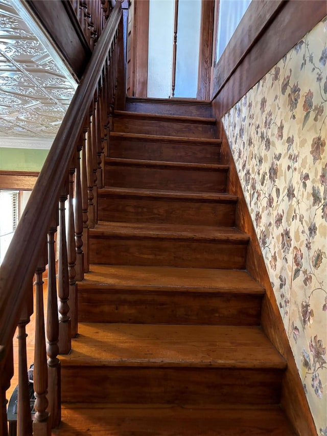 stairway featuring wood-type flooring