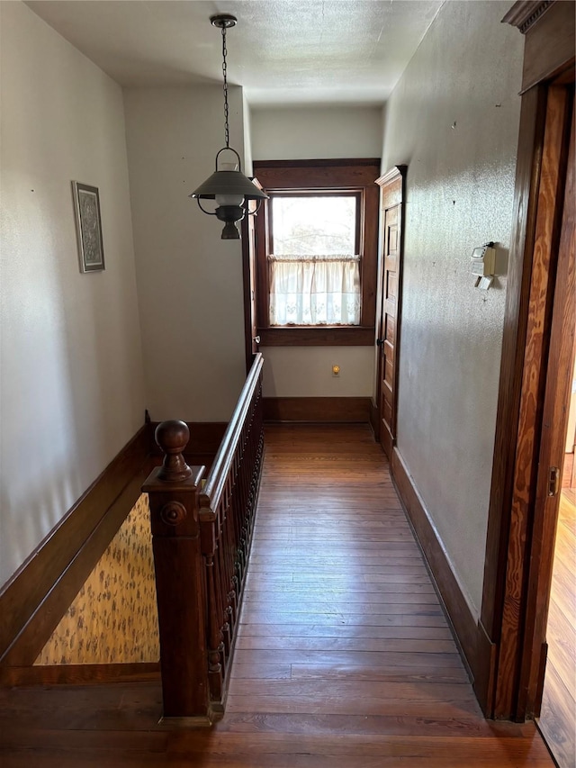 corridor featuring dark wood-type flooring