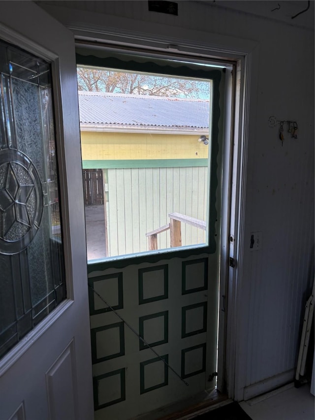 doorway to outside featuring plenty of natural light