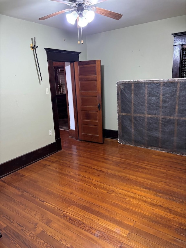 spare room featuring ceiling fan and wood-type flooring