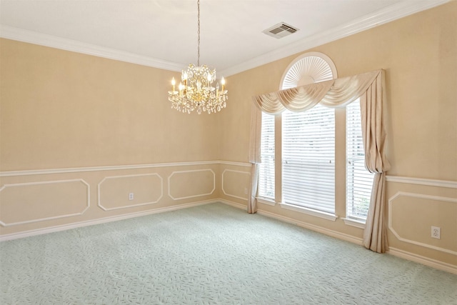 empty room featuring plenty of natural light, carpet, a chandelier, and ornamental molding