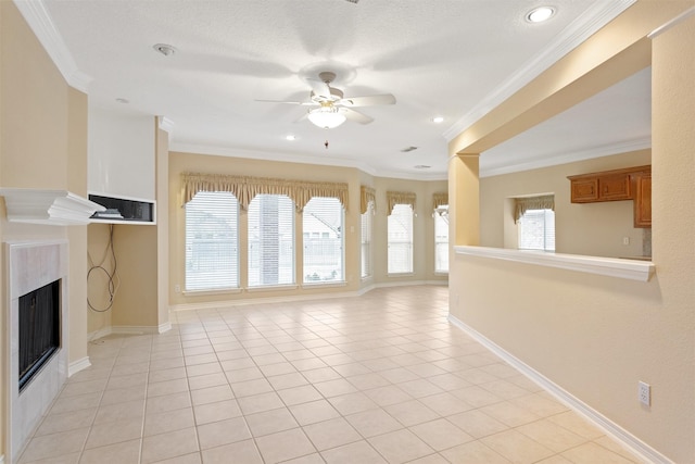 unfurnished living room with ceiling fan, a healthy amount of sunlight, and ornamental molding