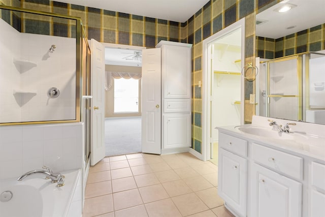 bathroom with tile patterned floors, vanity, and independent shower and bath