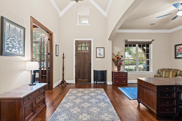 entryway featuring plenty of natural light, dark hardwood / wood-style flooring, and crown molding