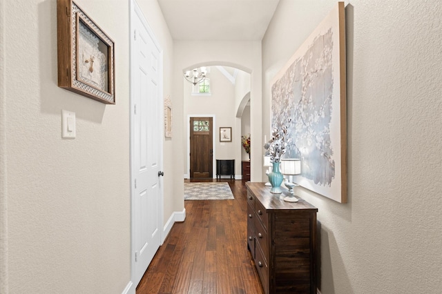 hall with dark hardwood / wood-style flooring