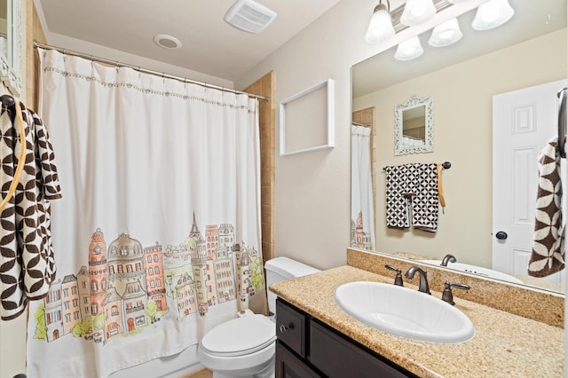 full bathroom with vanity, toilet, and shower / tub combo with curtain