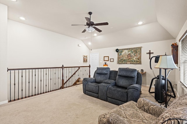 carpeted living room featuring ceiling fan and lofted ceiling