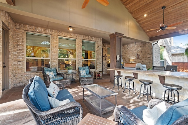 view of patio / terrace featuring outdoor lounge area, an outdoor bar, and ceiling fan