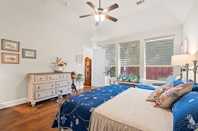 bedroom with hardwood / wood-style floors, ceiling fan, and vaulted ceiling