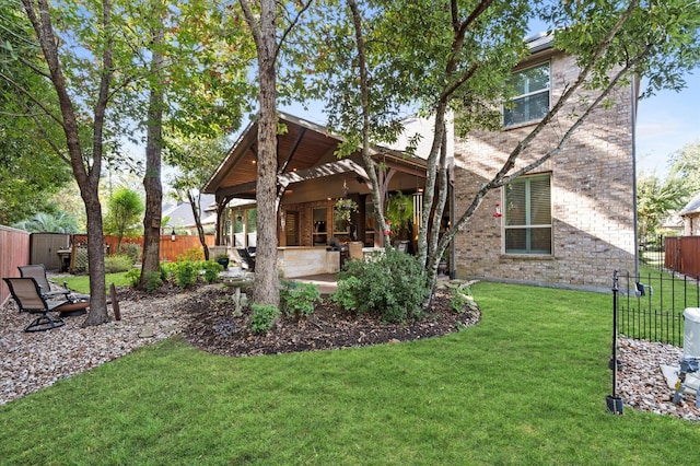 view of yard with a pergola and a patio area