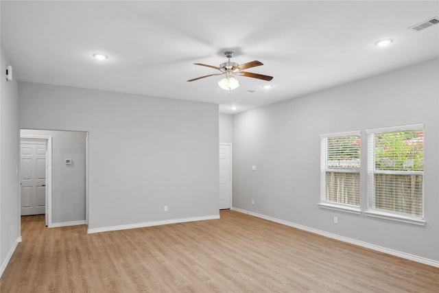 unfurnished room with light hardwood / wood-style flooring and ceiling fan