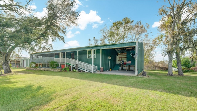 back of property featuring a lawn