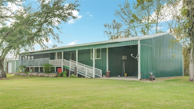 view of outbuilding with a yard