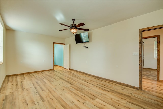 empty room featuring light hardwood / wood-style floors and ceiling fan