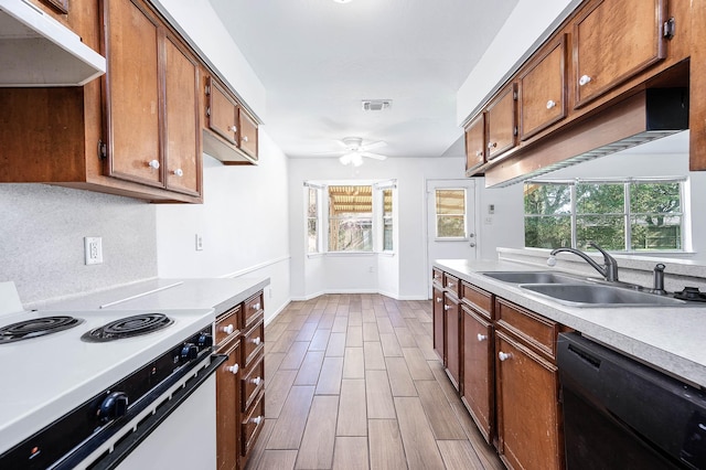 kitchen with white range with electric cooktop, dishwasher, plenty of natural light, and sink