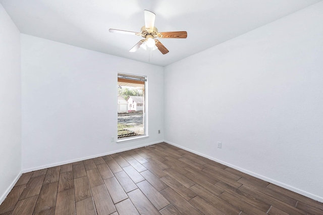 unfurnished room featuring ceiling fan and dark hardwood / wood-style flooring