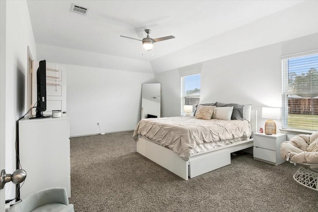 bedroom featuring ceiling fan, carpet, and vaulted ceiling