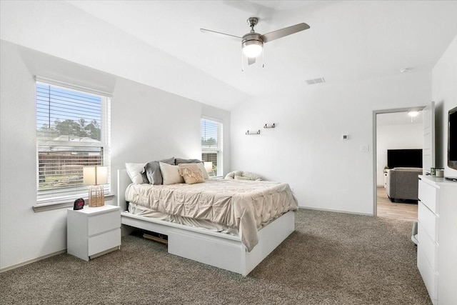 bedroom with carpet, ceiling fan, and lofted ceiling