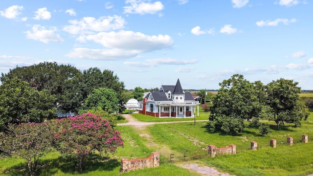 birds eye view of property with a rural view