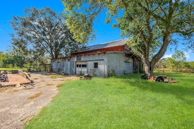 view of outdoor structure featuring a lawn