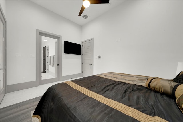 bedroom featuring ceiling fan and wood-type flooring