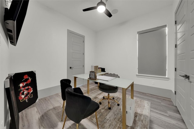 home office featuring ceiling fan and light wood-type flooring